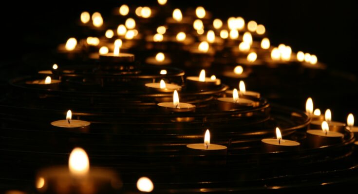 low-angle photo of lightened candles